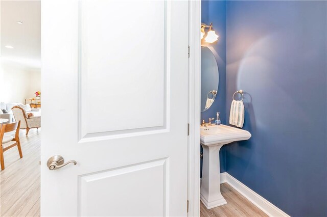 bathroom featuring wood-type flooring