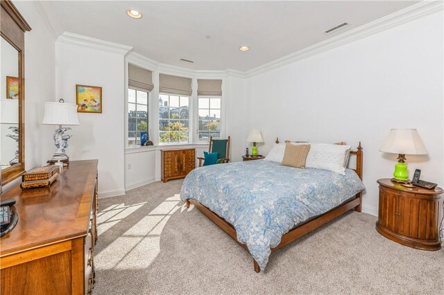 bedroom featuring light carpet and ornamental molding