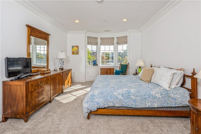 carpeted bedroom with ornamental molding