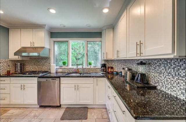 kitchen featuring white cabinetry, ornamental molding, appliances with stainless steel finishes, and tasteful backsplash