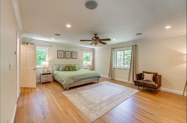 bedroom with ceiling fan, light hardwood / wood-style flooring, and crown molding