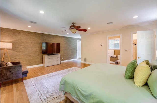 bedroom with hardwood / wood-style flooring, ceiling fan, and ornamental molding