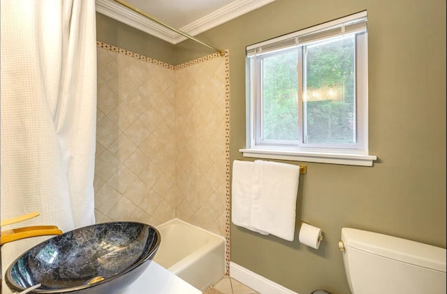 full bathroom featuring shower / tub combo with curtain, crown molding, sink, tile patterned flooring, and toilet