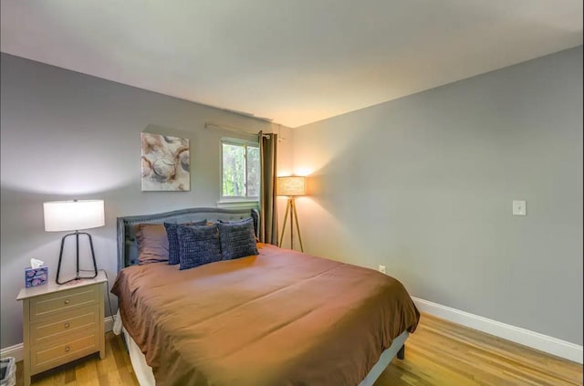 bedroom with light wood-type flooring