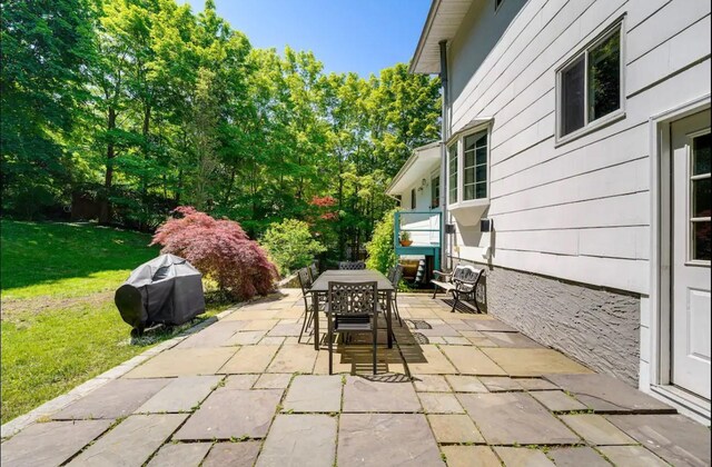 view of patio featuring a grill