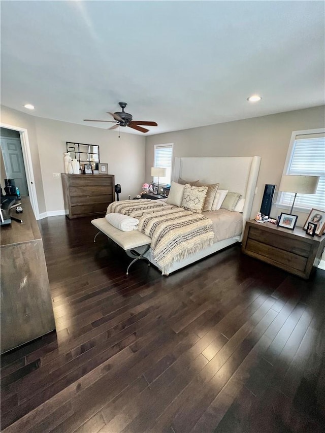 bedroom with ceiling fan and dark hardwood / wood-style flooring