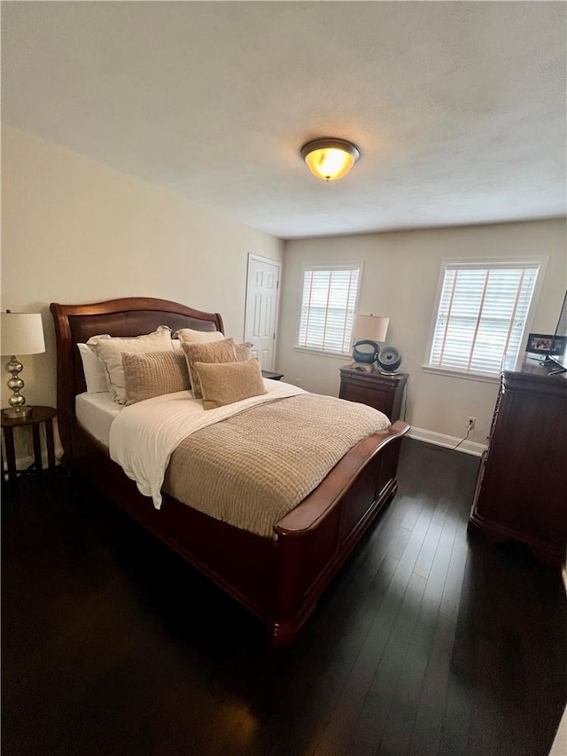 bedroom featuring dark hardwood / wood-style floors