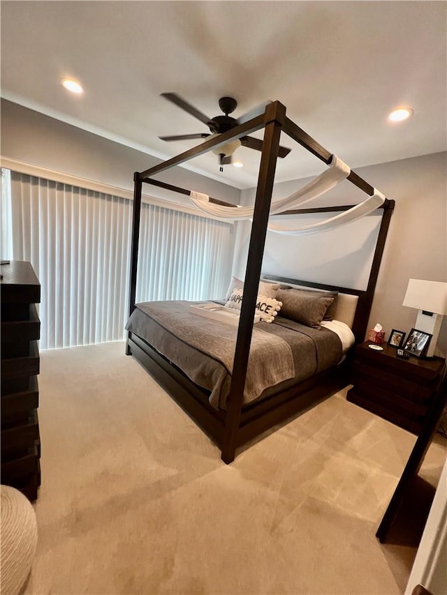 carpeted bedroom featuring ceiling fan