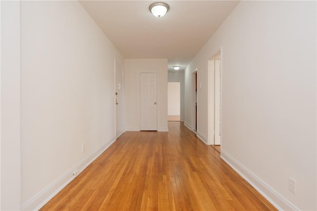 hallway with light wood-type flooring