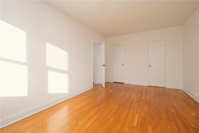 unfurnished room featuring light hardwood / wood-style floors