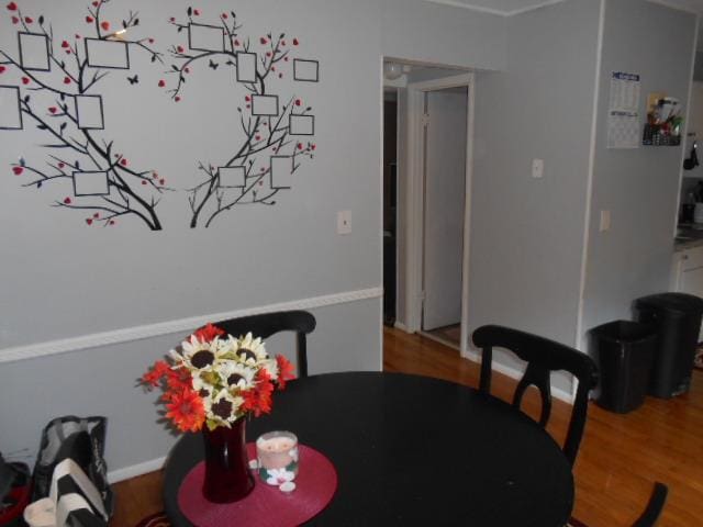 dining room with hardwood / wood-style flooring