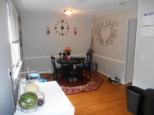 dining area with hardwood / wood-style flooring