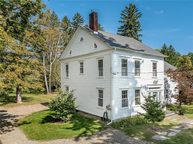 view of home's exterior featuring a lawn