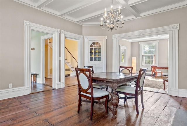 dining area with a chandelier, ornamental molding, coffered ceiling, dark wood-type flooring, and beam ceiling