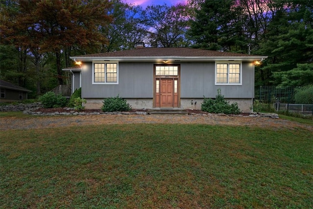 view of front of property with a lawn