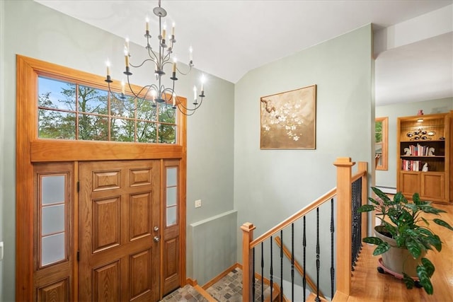 entryway with an inviting chandelier