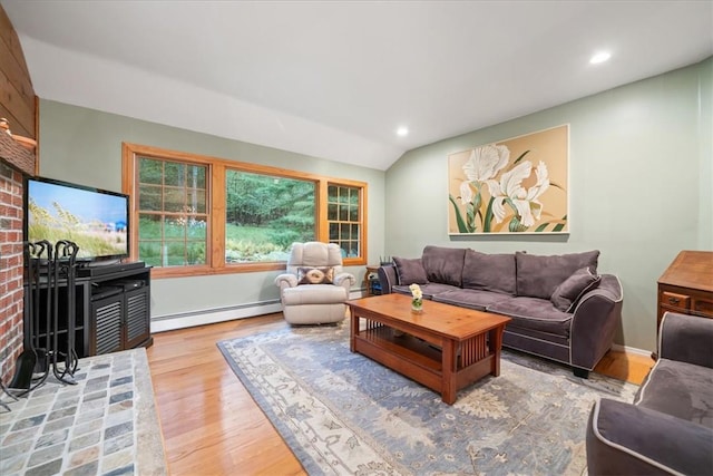 living room featuring wood-type flooring, vaulted ceiling, and baseboard heating