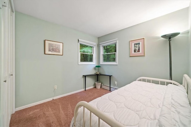 carpeted bedroom with baseboard heating