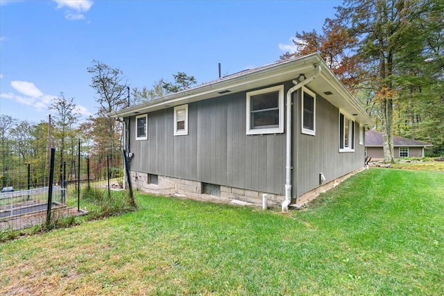 view of property exterior with a yard