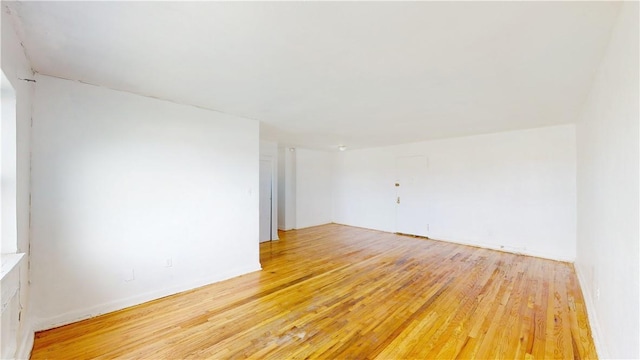 spare room featuring hardwood / wood-style floors