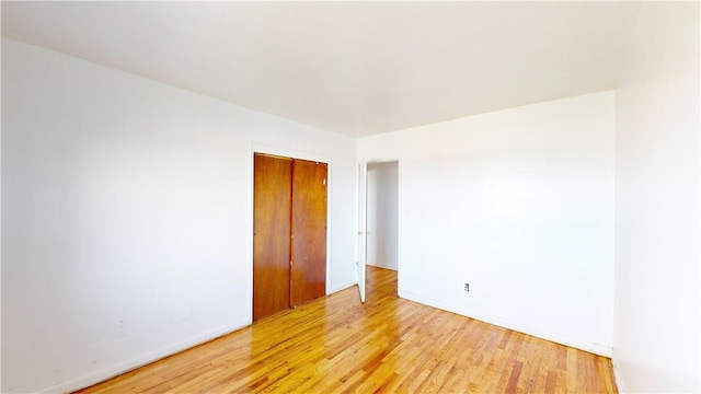 empty room with light hardwood / wood-style floors