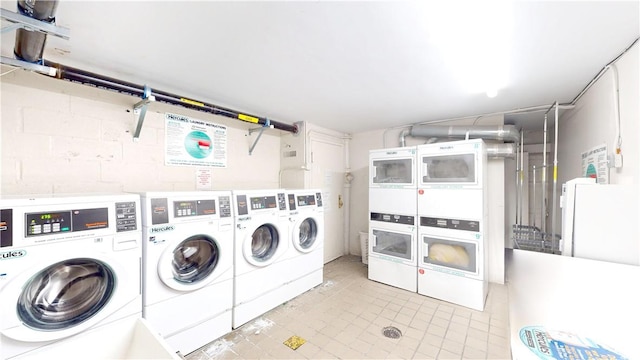 laundry room with separate washer and dryer and stacked washer and clothes dryer