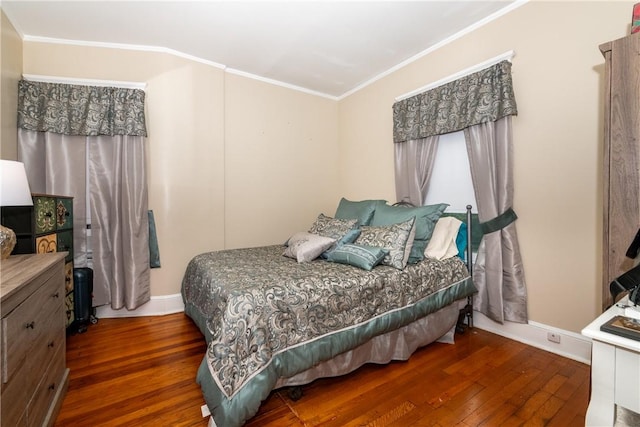 bedroom featuring ornamental molding and dark wood-type flooring