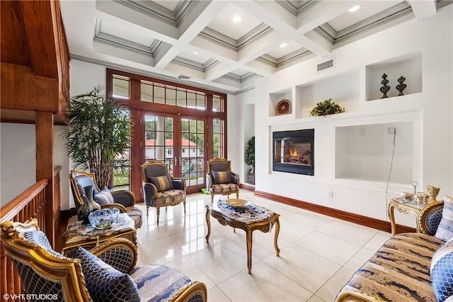 interior space featuring a high ceiling, light tile patterned floors, built in features, and french doors