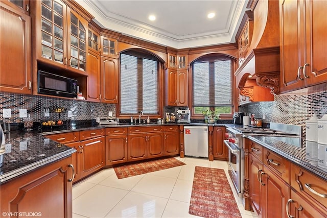 kitchen featuring light tile patterned floors, stainless steel appliances, crown molding, and sink