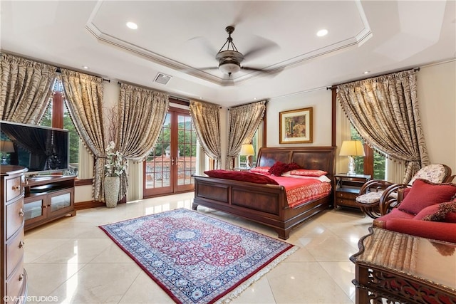 tiled bedroom with french doors, access to outside, a raised ceiling, and ceiling fan