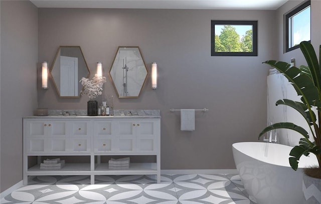 bathroom with a washtub and vanity