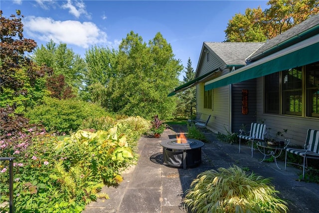 view of patio with a fire pit