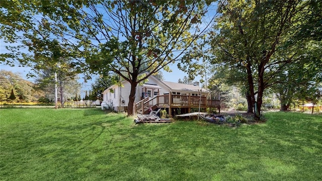 view of yard featuring a wooden deck