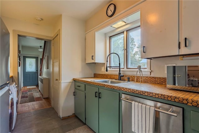 kitchen with white cabinetry, sink, stainless steel appliances, dark hardwood / wood-style flooring, and green cabinetry