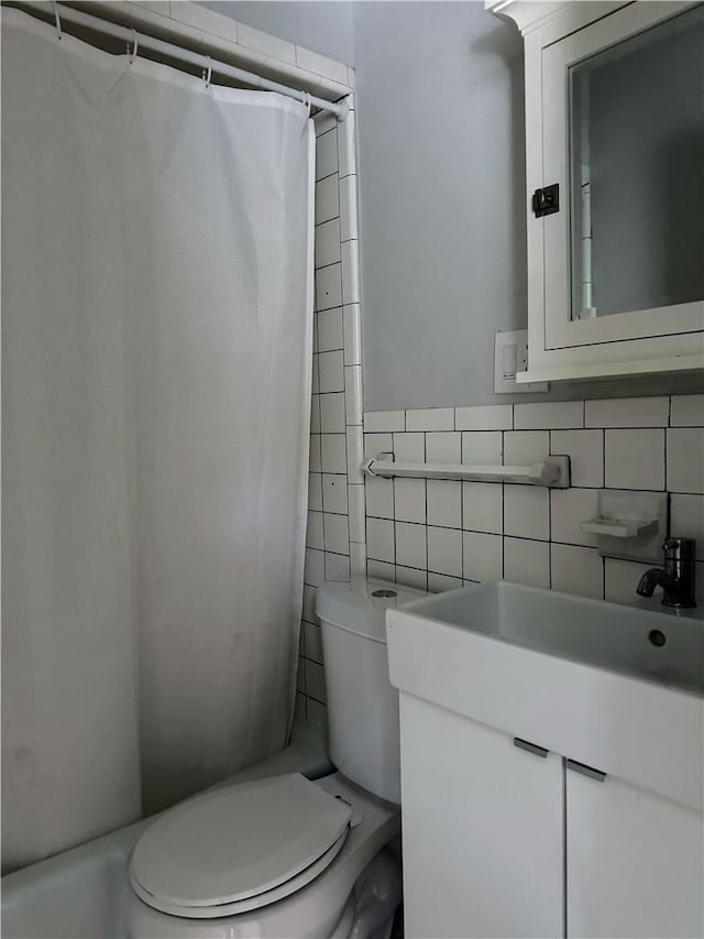 full bathroom featuring vanity, backsplash, toilet, tile walls, and shower / tub combo with curtain