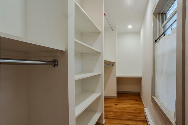 walk in closet featuring light hardwood / wood-style floors