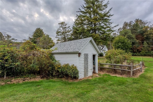 view of outdoor structure featuring a yard