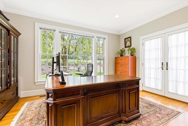 office space featuring ornamental molding, french doors, baseboards, and light wood-style floors