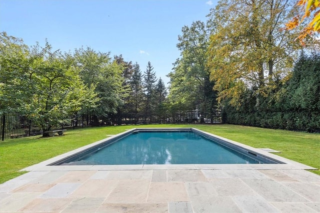 view of swimming pool featuring fence, a fenced in pool, and a yard