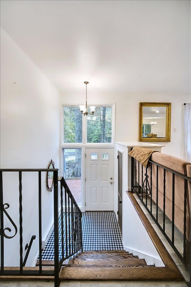 entrance foyer featuring an inviting chandelier