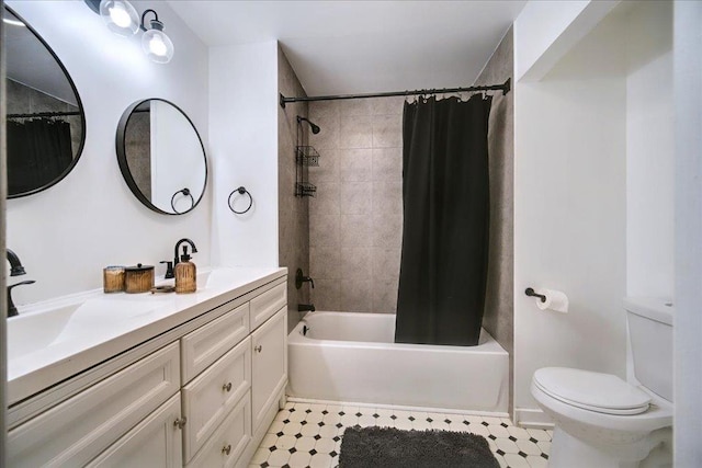 full bathroom with vanity, shower / tub combo, and toilet