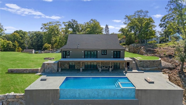 rear view of property with a yard and a patio