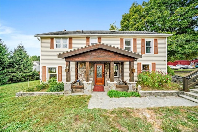 view of front of home featuring covered porch and a front yard