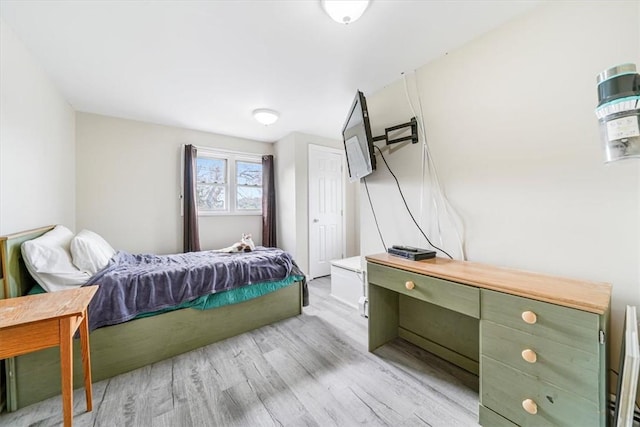 bedroom with light hardwood / wood-style floors