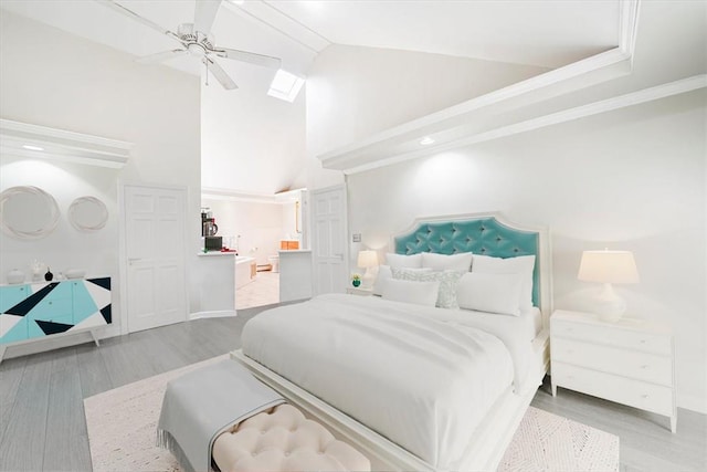 bedroom with wood-type flooring, high vaulted ceiling, ceiling fan, and crown molding