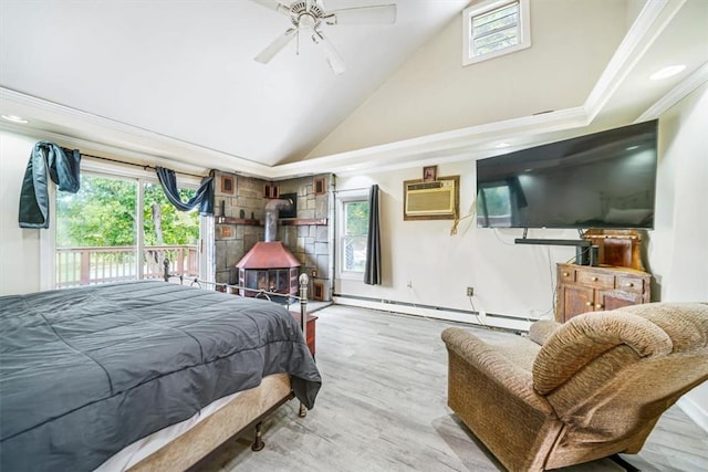 bedroom featuring ceiling fan, a baseboard heating unit, an AC wall unit, light wood-type flooring, and ornamental molding