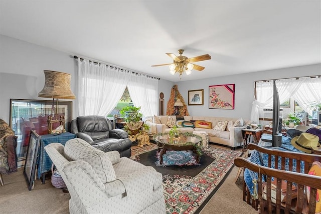 carpeted living room featuring ceiling fan