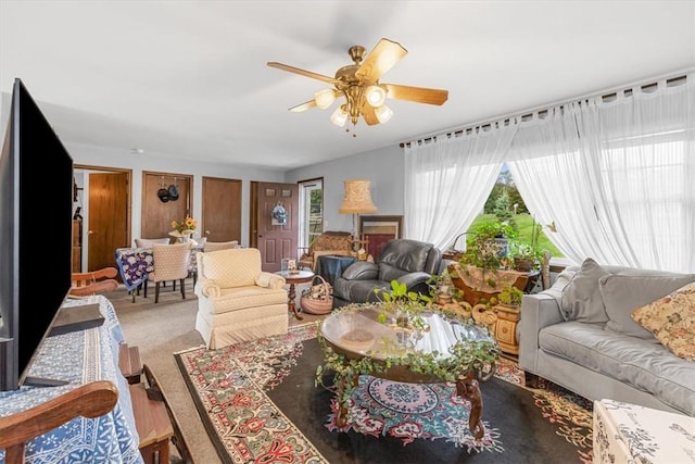 living room with carpet flooring and ceiling fan