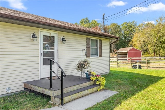 entrance to property with a lawn