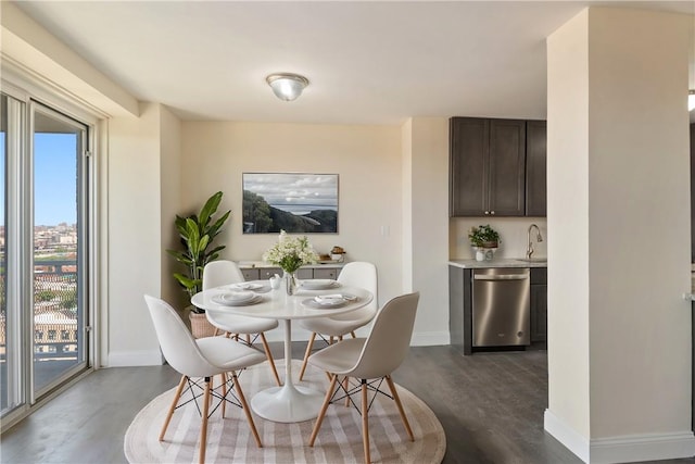 dining area with dark hardwood / wood-style flooring and sink